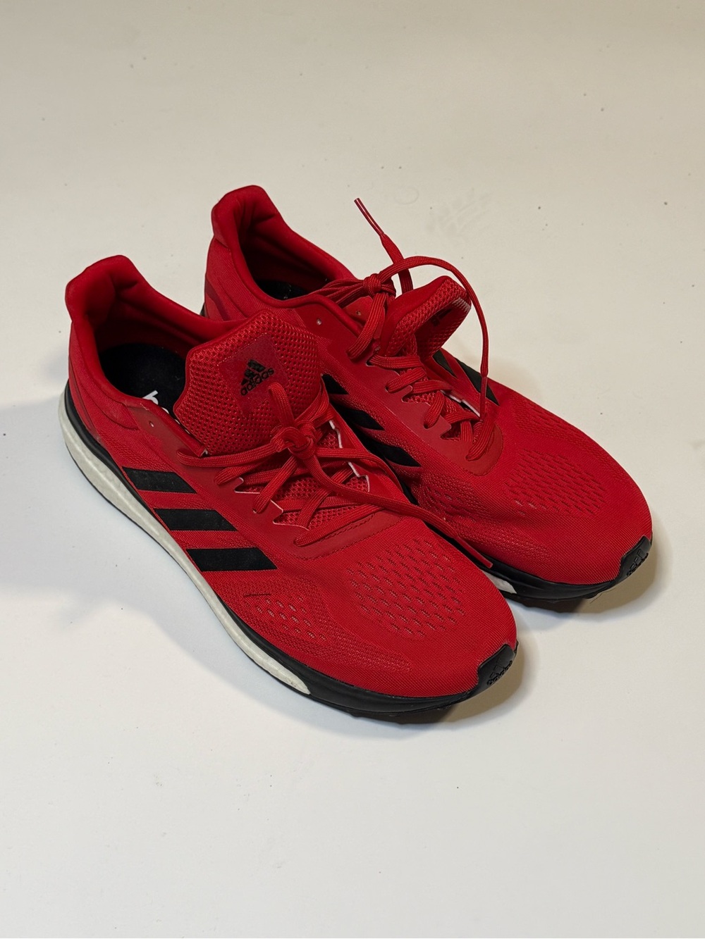 adidas Men’s Red Athletic Boost Running Shoes with Black Stripes